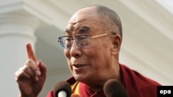 The Dalai Lama speaks outside the White House after meeting President Barack Obama.