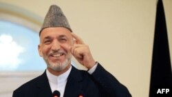 President Karzai's office has said it will accept the Independent Election Commission's decision, but notes the Afghan Constitution makes no mention of a transitional government.