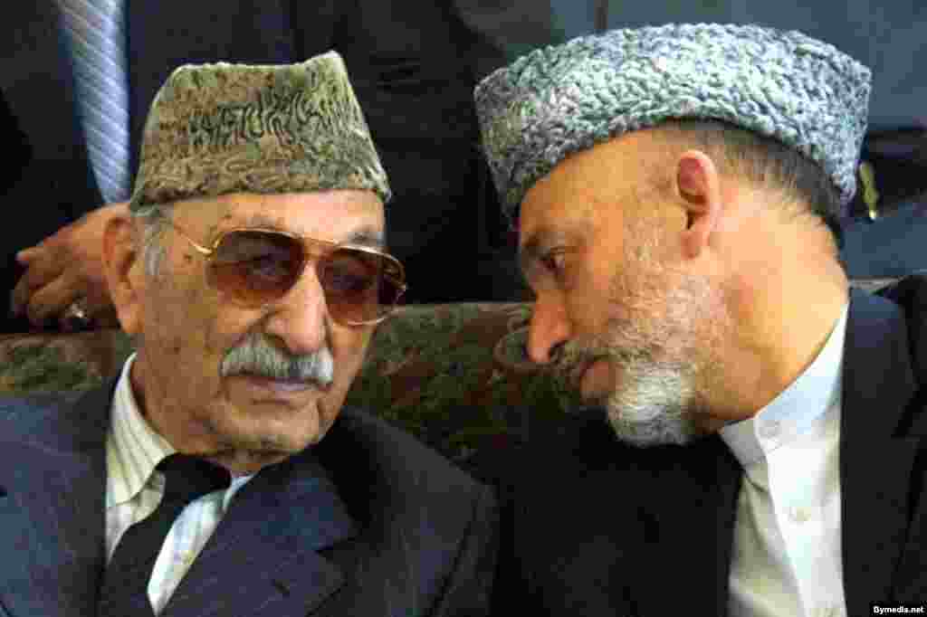 Former monarch Mohammad Zahir Shah (left) speaks with the man chosen by the international community in late 2001 to lead the Afghan Interim Authority after the Taliban was ousted, Hamid Karzai. Karzai has presided continuously ever since.