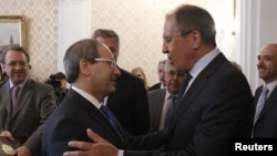 Russian Foreign Minister Sergei Lavrov (right) welcomed Syrian Deputy Foreign Minister Faisal Mekdad for a meeting in Moscow on May 22.