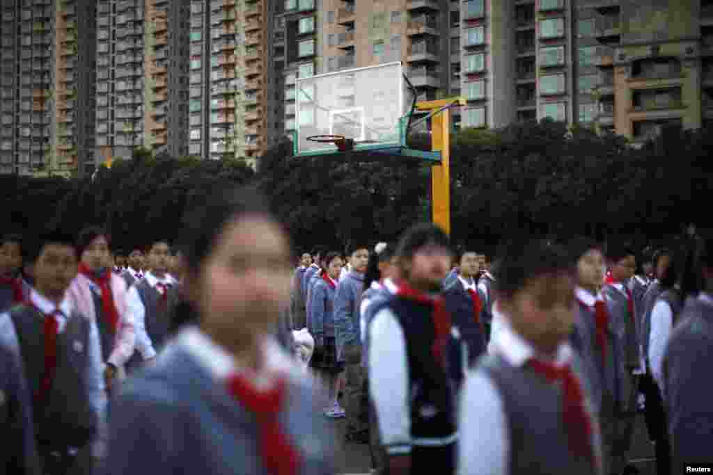 Young Pioneers gather during a flag-raising ceremony at the East Experimental School in Shanghai.