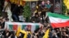 People carry the coffin of Razi Mousavi during his funeral in Tehran on December 28.