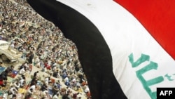 Iraqi flag over worshippers in Baghdad (file photo)