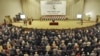 Lawmakers take the oath of office during the first session of Iraq's new parliament on June 14 in Baghdad.