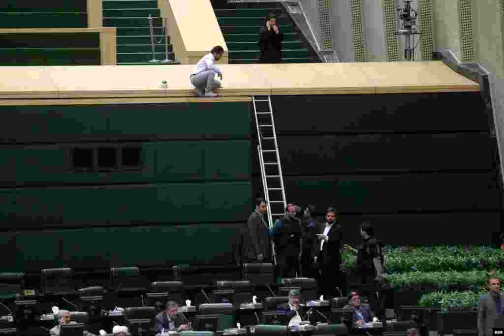 Iranian policemen deployed inside the parliament building