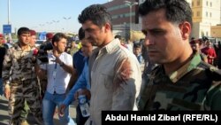 Members of the Asayish security services following a terrorist attack on their headquarters in Irbil