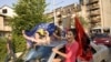 Kosovar Albanians celebrate the court ruling in the divided town of Mitrovica in northern Kosovo.