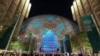 People walk at Dubai's Expo City during the United Nations Climate Change Conference (COP28) in Dubai.