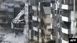 A video grab from April shows heavily damaged buildings in the Juret al-Shiyah district of the flashpoint Syrian city of Homs.