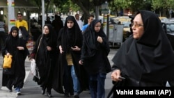 Iranian women are required by law to cover their hair and body in public. (file photo)