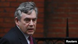 Former British Prime Minister Gordon Brown arrives to give evidence before the Leveson Inquiry at the High Court in London.