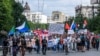 People carry a banner reading "Return Furgal to us" during a rally in support of Sergei Furgal in Khabarovsk on August 8.