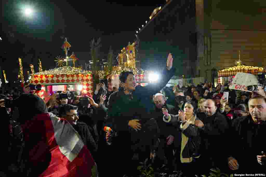 Georgia&#39;s former President Salome Zurabishvili, the most prominent political supporter of the anti-government protests, greets protesters on December 25.&nbsp;