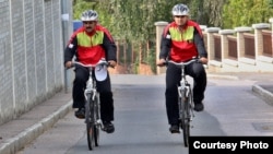 Nadir Shah Nangarhari and his son Feruz Khan, seen here in Prague, are pedaling across Europe and the United States to raise awareness about the problems still plaguing their country.